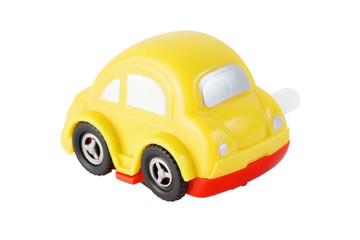 Fototapeta na wymiar jasny żółty samochód zabawka mechaniczna okien srebra
