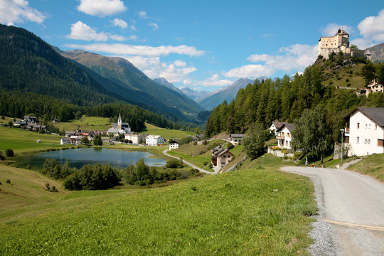 Tarasp Switzerland mountains in the summer and a castle