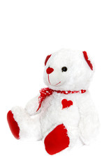 медведь с красной лентой на белом фоне