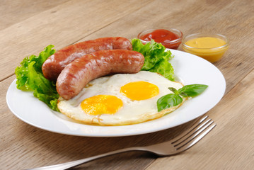Fried eggs with sausages