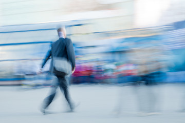 Motion blured businessman rushing to office in a city - 37388481