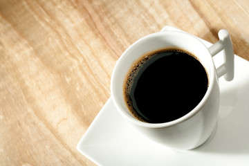 coffee cup over wooden desk