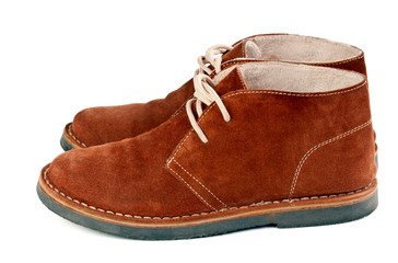 a pair of brown suede shoes