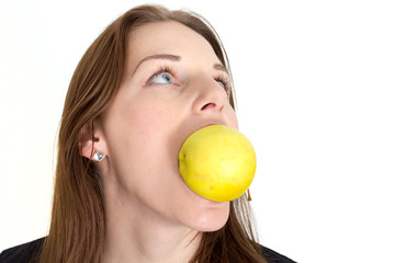 Woman Biting A Yellow Apple