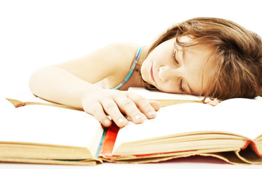 Girl asleep on the books