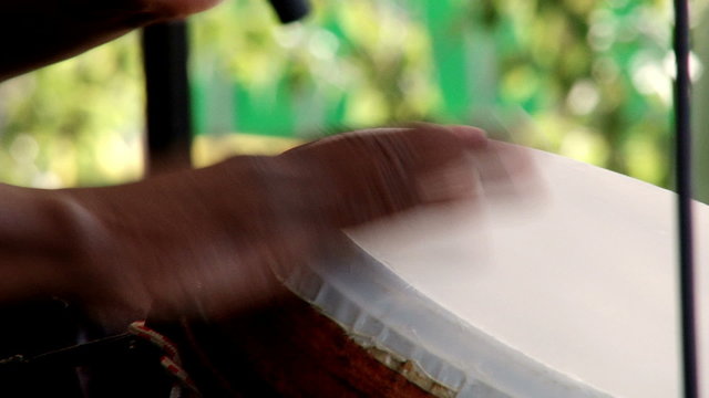 Man playing Afro percussion, conga