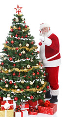 Santa Claus decorating  Christmas tree