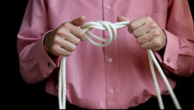 man ties a knot