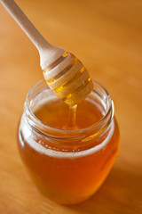 Fototapeta na wymiar Real honey with stick