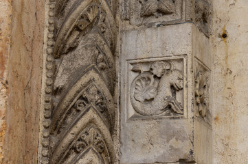 Carving on the Facade of the cathedral in Ferrara Italy