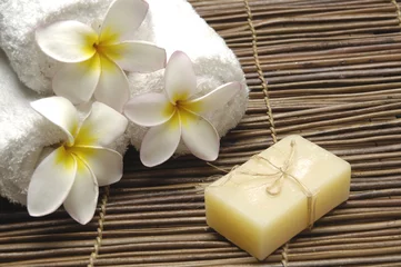 Fototapete Rund Spa Frangipani flower with towel and natural handmade soap on mat  © Mee Ting