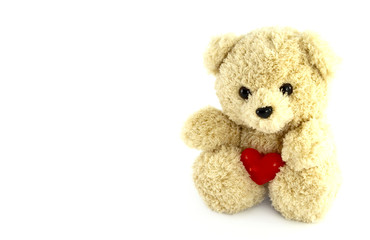 teddy bear toy with heart on white background