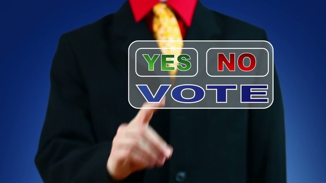 Businessman pressing Yes button for vote