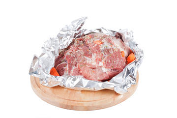Meat prepared for roasting in a foil
