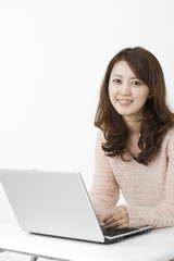Beautiful asian woman using a laptop computer