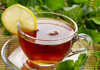 Cup of tea with lemon and mint