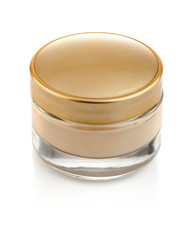 glass can with cream and gold lid isolated on white background