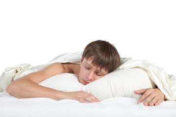 Young man sleeping in bed