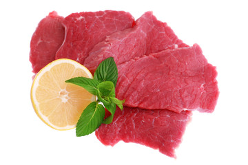 Cut of  beef steak  with lemon slice. Isolated.
