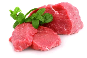 Papier Peint photo Steakhouse Cut of  beef steak with green leaf. Isolated.