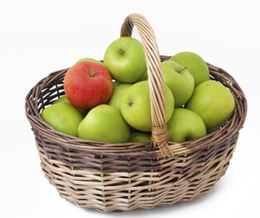 basket with green apples and one red one