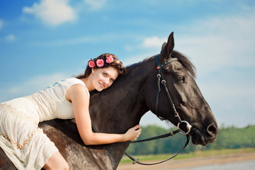 Woman on a horse by the sea