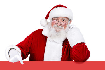 Santa Claus pointing at blank sign