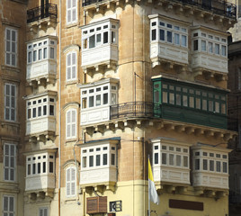Fototapeta na wymiar Baroque Facades And Traditional Balconies In Valletta Street