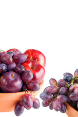 Grape fruits and red apples, white copy space
