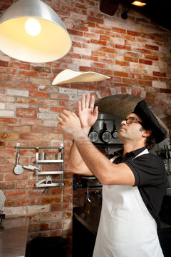 Pizza Chef playing with Pizza Dough