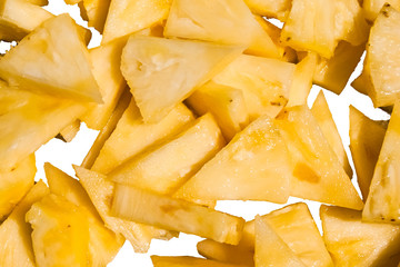 Many pineapple  slices, isolated on white background