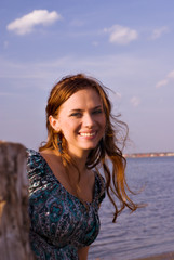 Girl in dress at lake