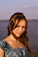 Girl in dress at lake