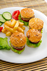 French fries and burgers in the plate
