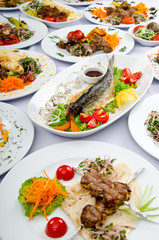 Lots of meals served on table
