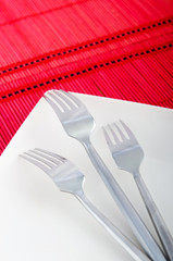 Empty plate with utensils