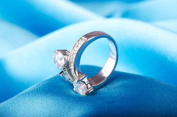 Fashion concept with ring on background