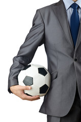 Businessman holding football on white