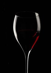 red wine glass isolated on black background