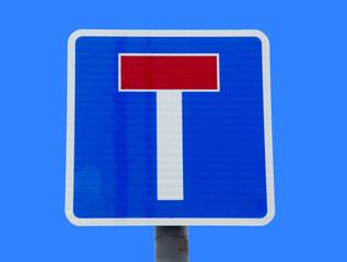 dead end sign on blue sky