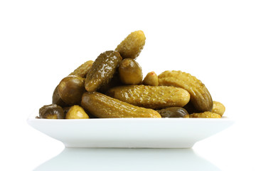 Marinated cucumbers on the plate isolated on white
