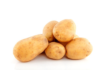 Stacked unpeeled potatoes