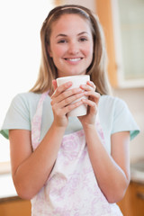 Portrait of a woman drinking a cup of coffee