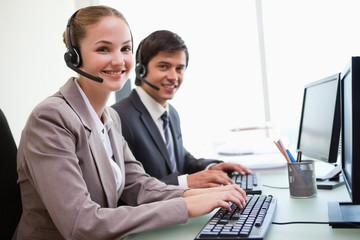 Young office workers using computers