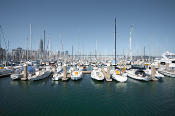 Fototapeta premium Sailboats Moored In Harbor Horizontal