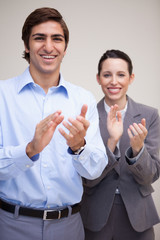 Fototapeta premium Standing business team clapping