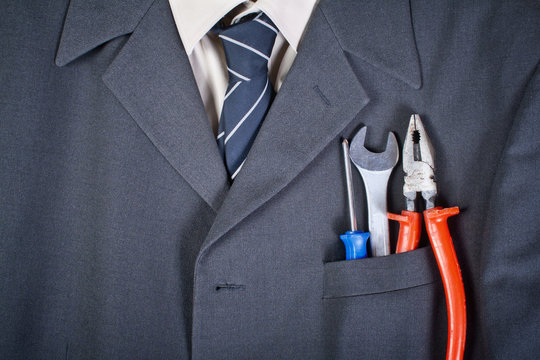 tools  in the businessman pocket