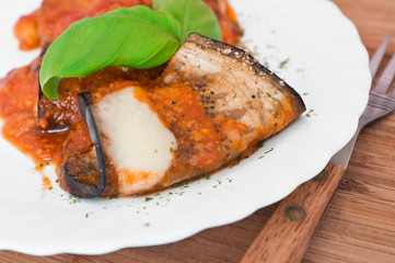 Eggplant rolls with tomato sauce.