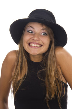 Young woman in a black hat on a white background