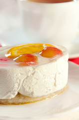 Delicious cake with fresh fruit and tea